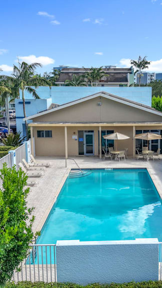 A green canopy is over a picnic table.