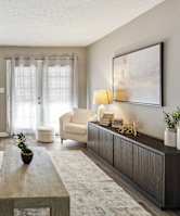 a sofa with white cushions in a living room