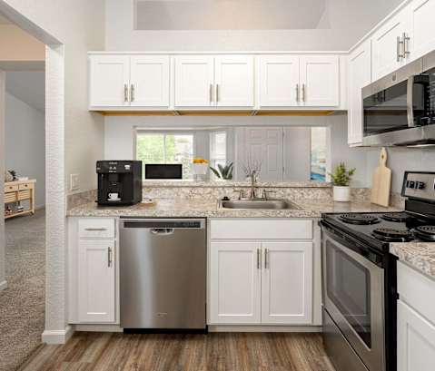 Kitchen with Cabinets and stove top oven at Woodland Meadows, Michigan, 48035