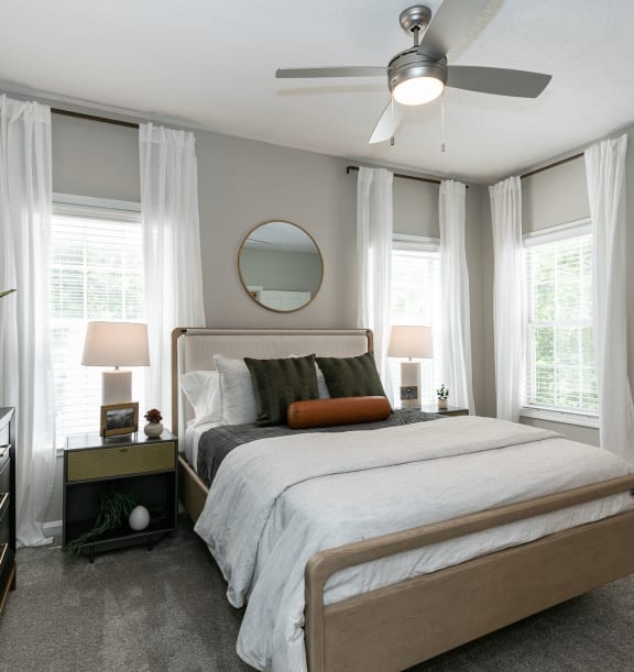 the preserve at ballantyne commons bedroom with bed and ceiling fan