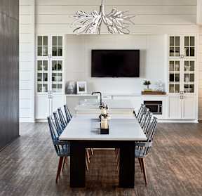A modern dining room with a long table and chairs at Beckett Farms Apartments, PRG Real Estate Management, Fort Mill