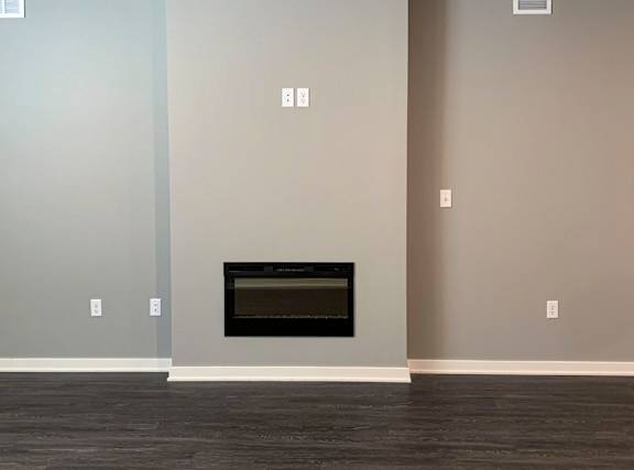Electric fireplace in living room wall of the buffalo floorplan