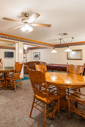 A room with a table and chairs in it.