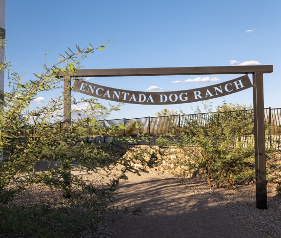 a sign for the excavation dog ranch in front of a building