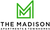 A green letter M on a black background at The Madison Apartments and Townhomes, Georgia 30044