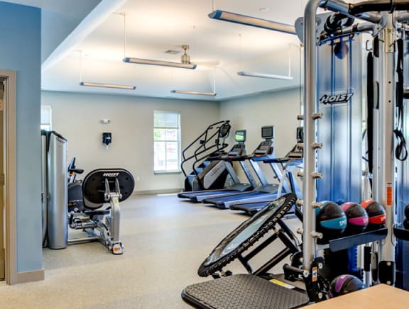 fitness center with cardio equipment and strength training