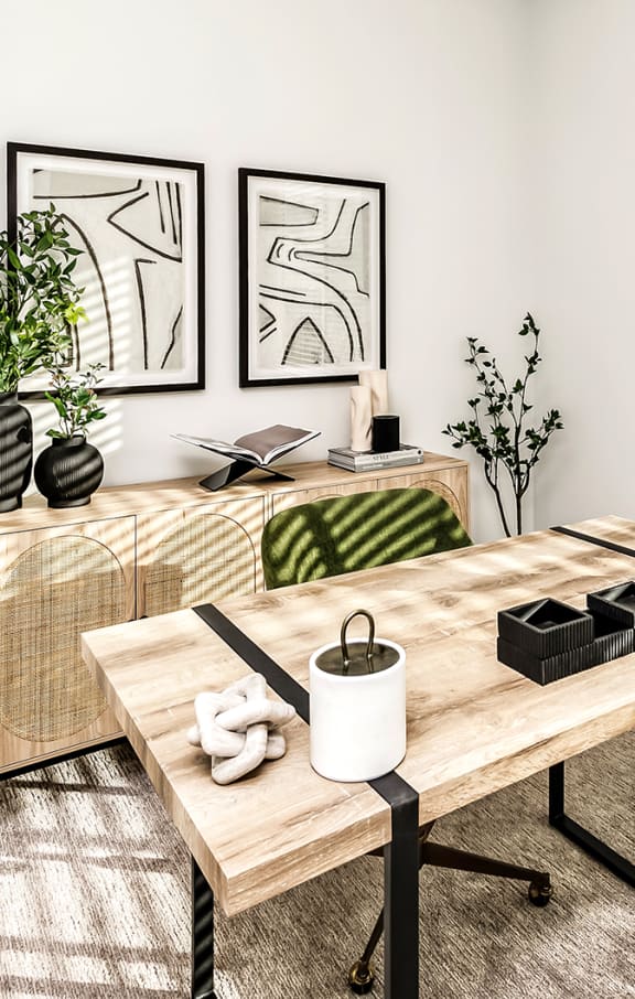 a home office with a wooden desk and a window