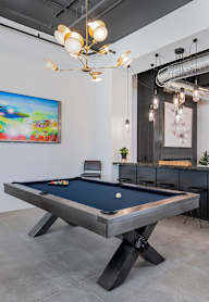 Pool table with art in the background
