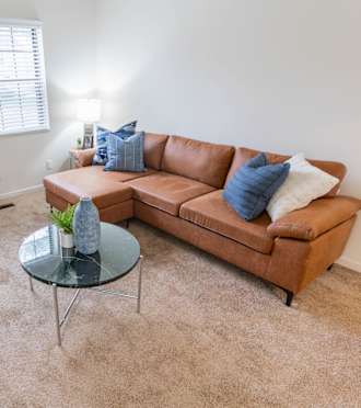 a living room with a couch and a table