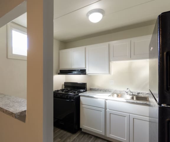 This is a photo of the kitchen of a 1245 square foot 2 bedroom apartment at Cambridge Court Apartments in Dallas, TX.