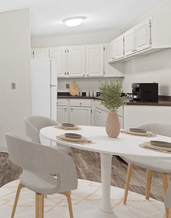 A modern living room with a dining table set for four.