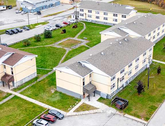 An aerial view of a large building complex with multiple buildings and parking lots.