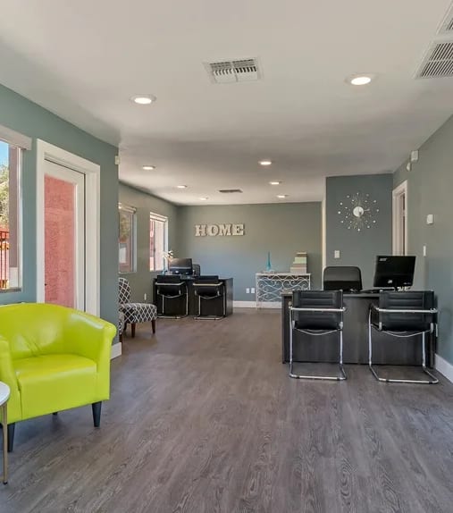 leasing area with chairs and two desks at Spring Meadow Apartments in Glendale, AZ
