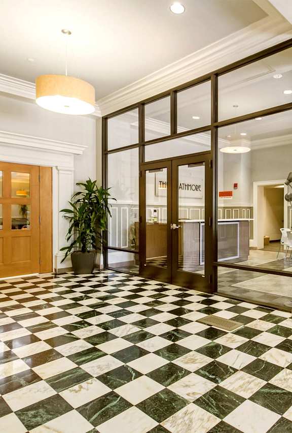 A hallway with a black and white checkered floor.