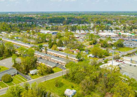 an aerial view of a city with many buildings and trees