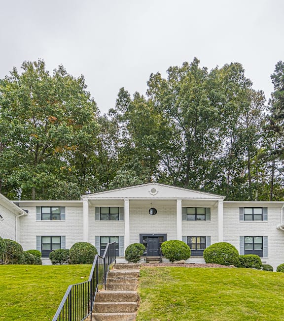 A white house with a black gate in front  grass at Georgian Oaks Apartments in Smyrna , Georgia, 30080