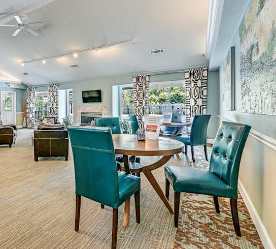 A room with a table and chairs in it.