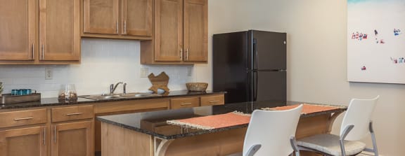 The kitchenette area in the community room at Villas on the Strand in Galveston, TX