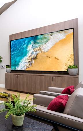 clubroom with a large grey sofa and a coffee table.