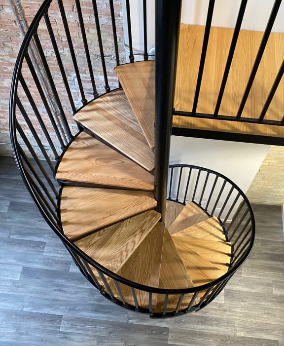spiral staircase wooden step metal rail