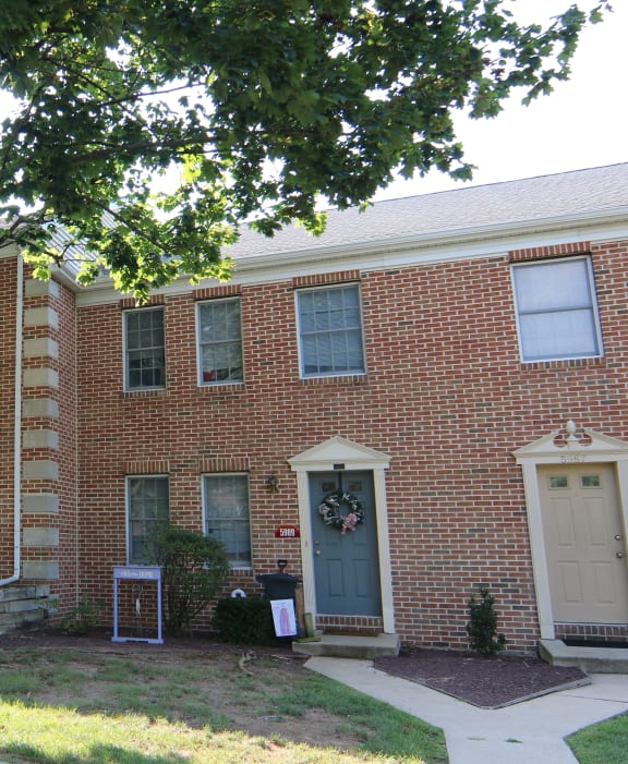 a row of three story houses on a street