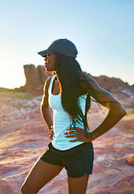 a woman running in the desert at sunset at Connect on Northern Apartments, Glendale 85301