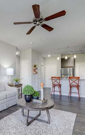 a living room and dining room with a couch and a table