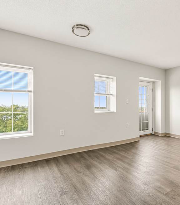 A room with a window and a door.