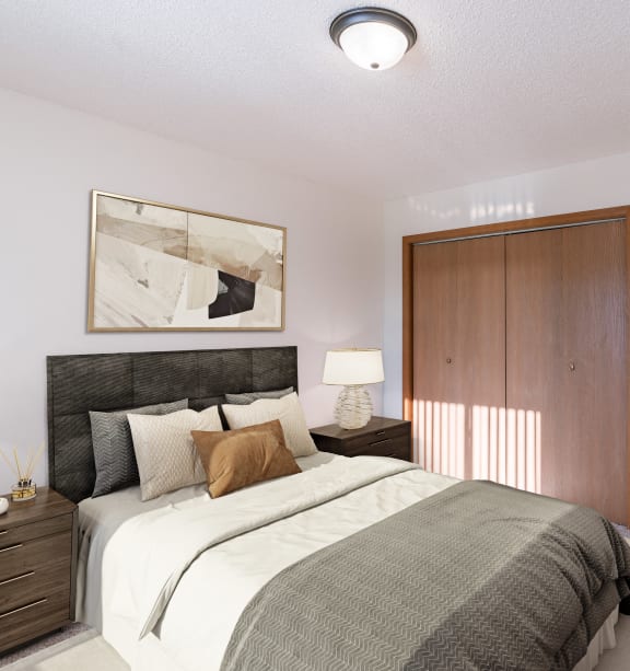 Grand Forks, ND Chandler 1898 | a bedroom with a bed and a nightstand with a lamp