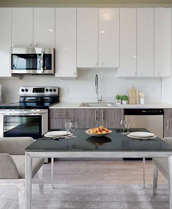 A modern kitchen with a glass table and chairs.