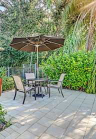 A spacious living room with wooden floors and furniture. at Westminster Chase Apartments, Tampa, Florida