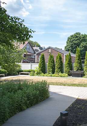 A park with a bench and a pathway.