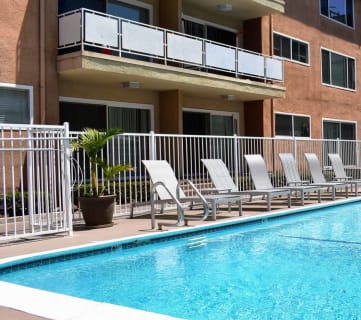 community pool and lounge chairs