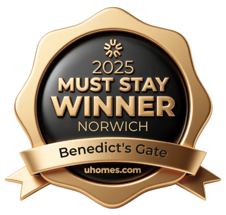 A gold and black award badge for the 2025 Must Stay Winner at Benedict's Gate in Norwich.