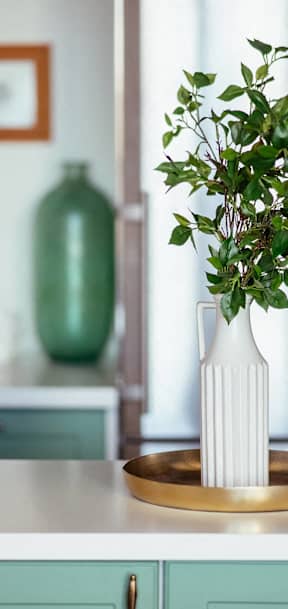 a door handle with a living room in the background