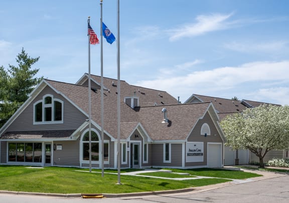 a house with two flags on the roof