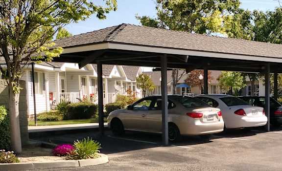 Image of cars under roof in parking area