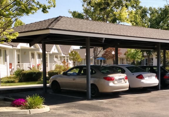 Image of cars under roof in parking area