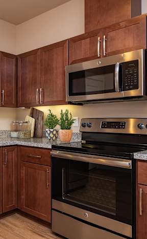 a kitchen with stainless steel appliances and granite counter tops