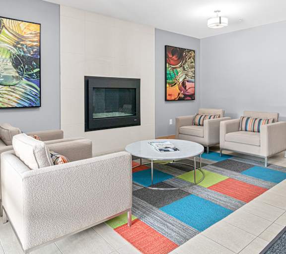 a living room with a couch and two chairs