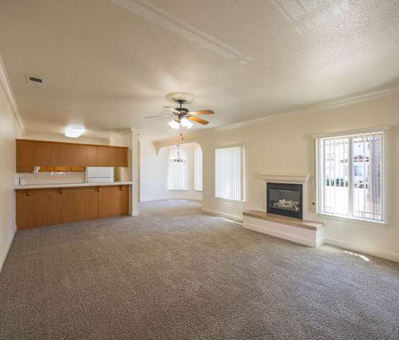 A living room with a grey couch and a coffee table.