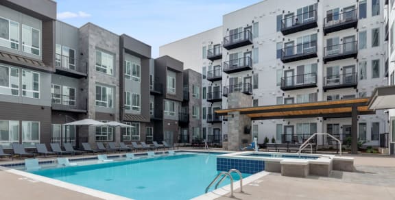 a swimming pool in the middle of an apartment building