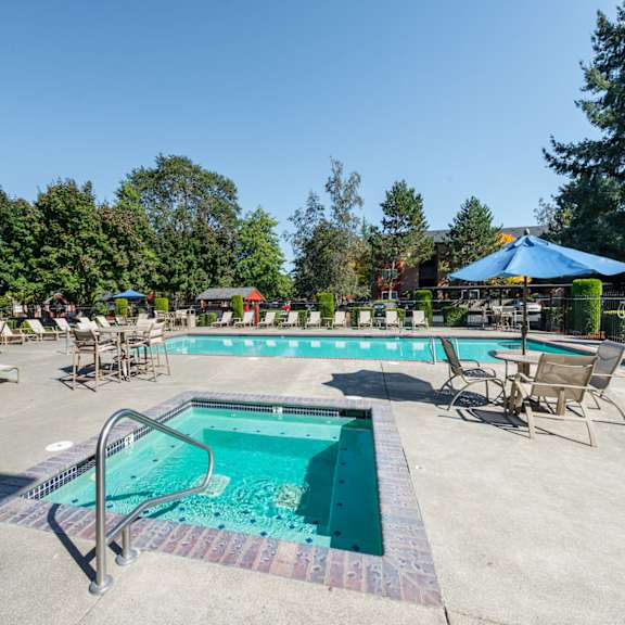 Pool and spa at The Village at Seeley Lake Apartments, Lakewood, Washington