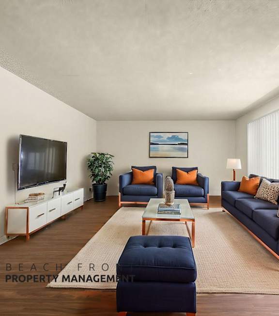 A well-lit, modern kitchen and living room with a dining area.