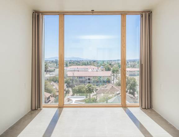 Herbert Residential Apartments in Tucson, Arizona Bedroom with Floor to Ceiling Windows