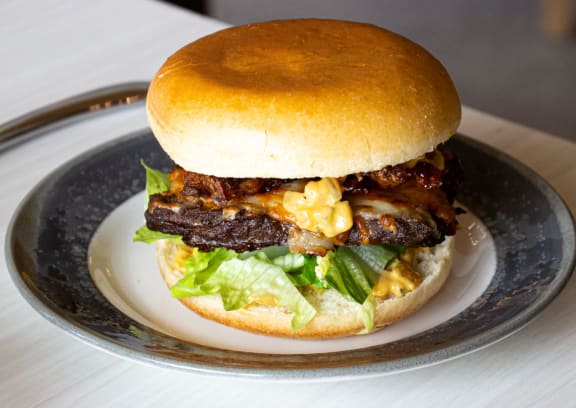 a hamburger on a plate on a table