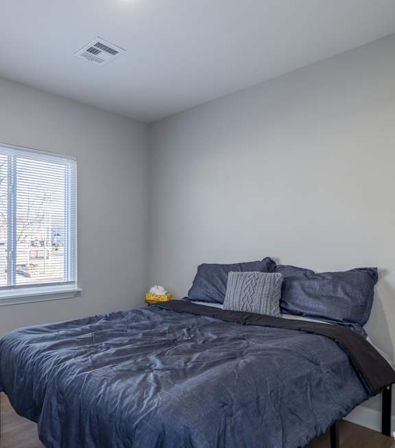Bedroom with Bed at University Digs Apartments, Pittsburg, Kansas