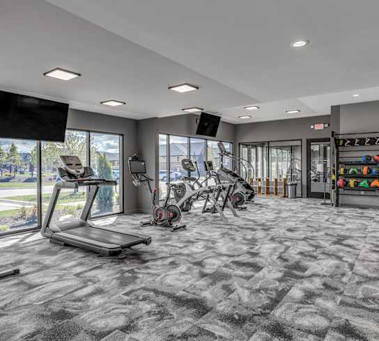 On-site fitness studio at Quarry Apartments and Townhomes in DeWitt, Michigan
