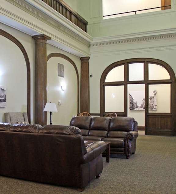 a bedroom with a large bed and a ceiling fan