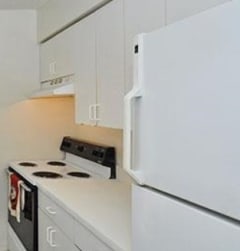 a kitchen with a stove and a refrigerator at Oak Chase I, Tampa, FL